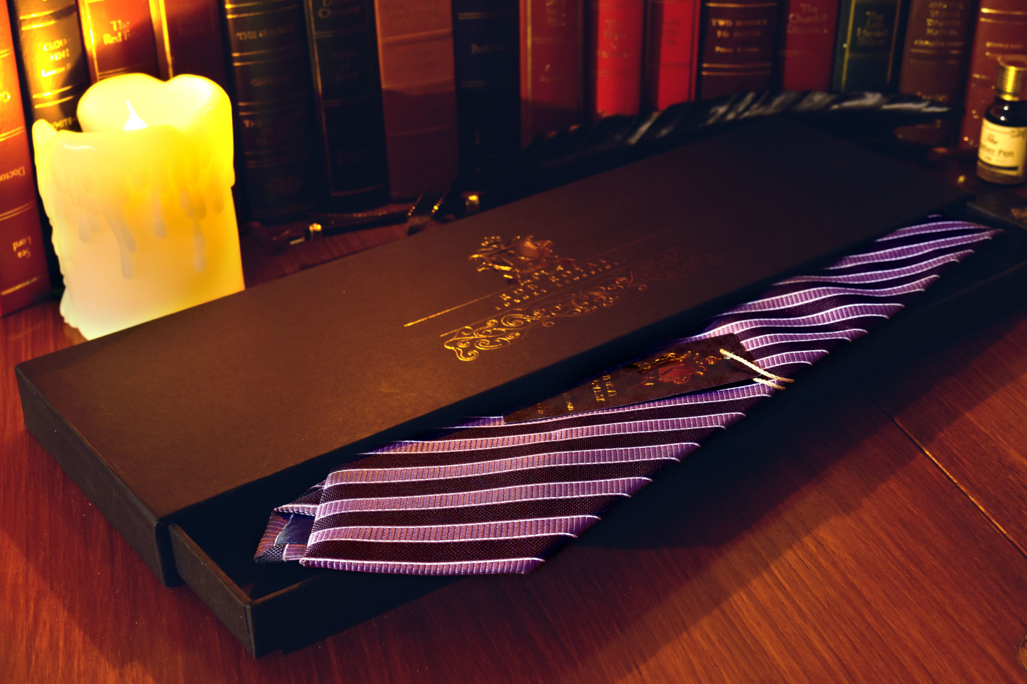 Purple tie with black stripes
